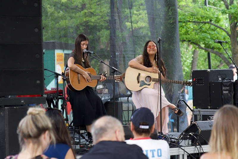 sākihiwē - two young female artists performing with acoustic guitars