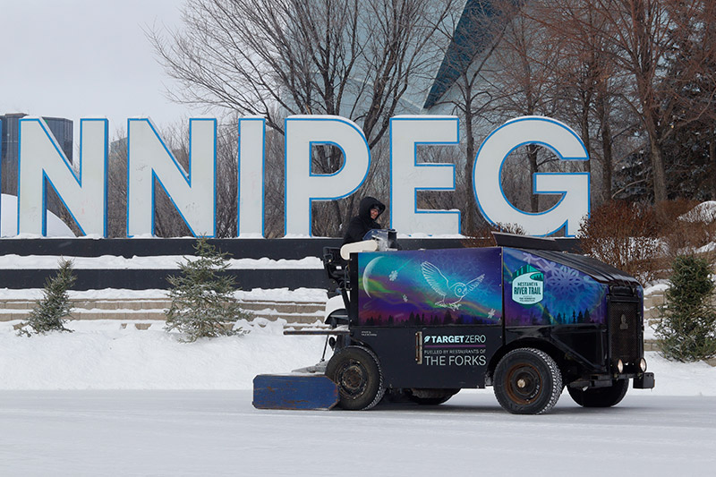 Trail Maintenance Zamboni cleaning ice near Winnipeg sign